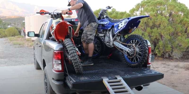 load the second bike and lean it against the  truck.